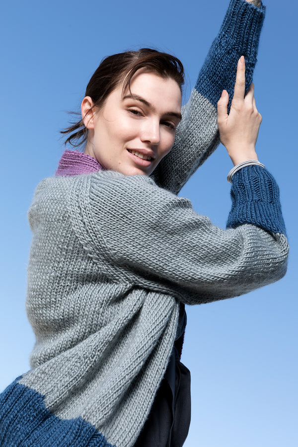 side view of silver  purple and blue pure wool cardigan