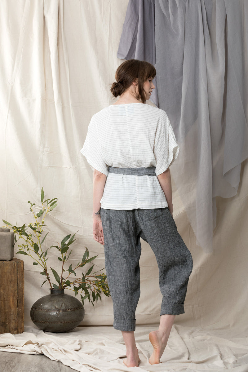 Back of linen pants showing patch pockets worn with a organic cotton kimono inspired top