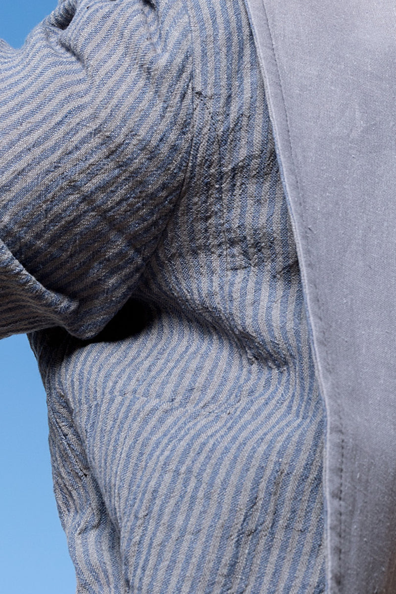 Close up of crushed linen in striped grey and blue