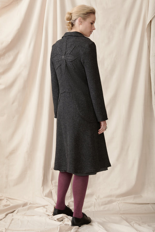 back of wool coat with applique detail and raw edges