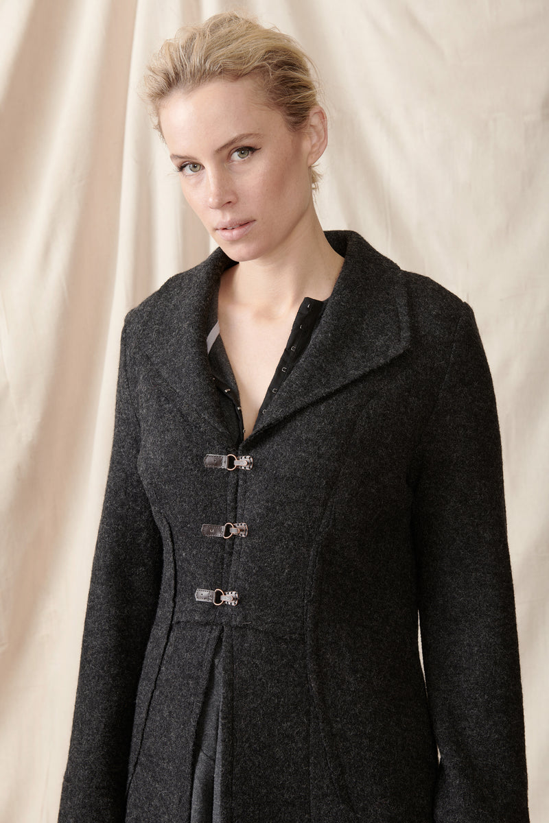 Front of charcoal wool coat leather and copperclasps