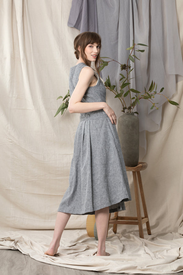Back of sleeveless wrap dress in grey blue linen organic cotton.