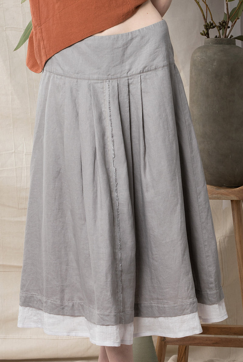 Pure linen taupe skirt with front pleats and a contrast sliver hem